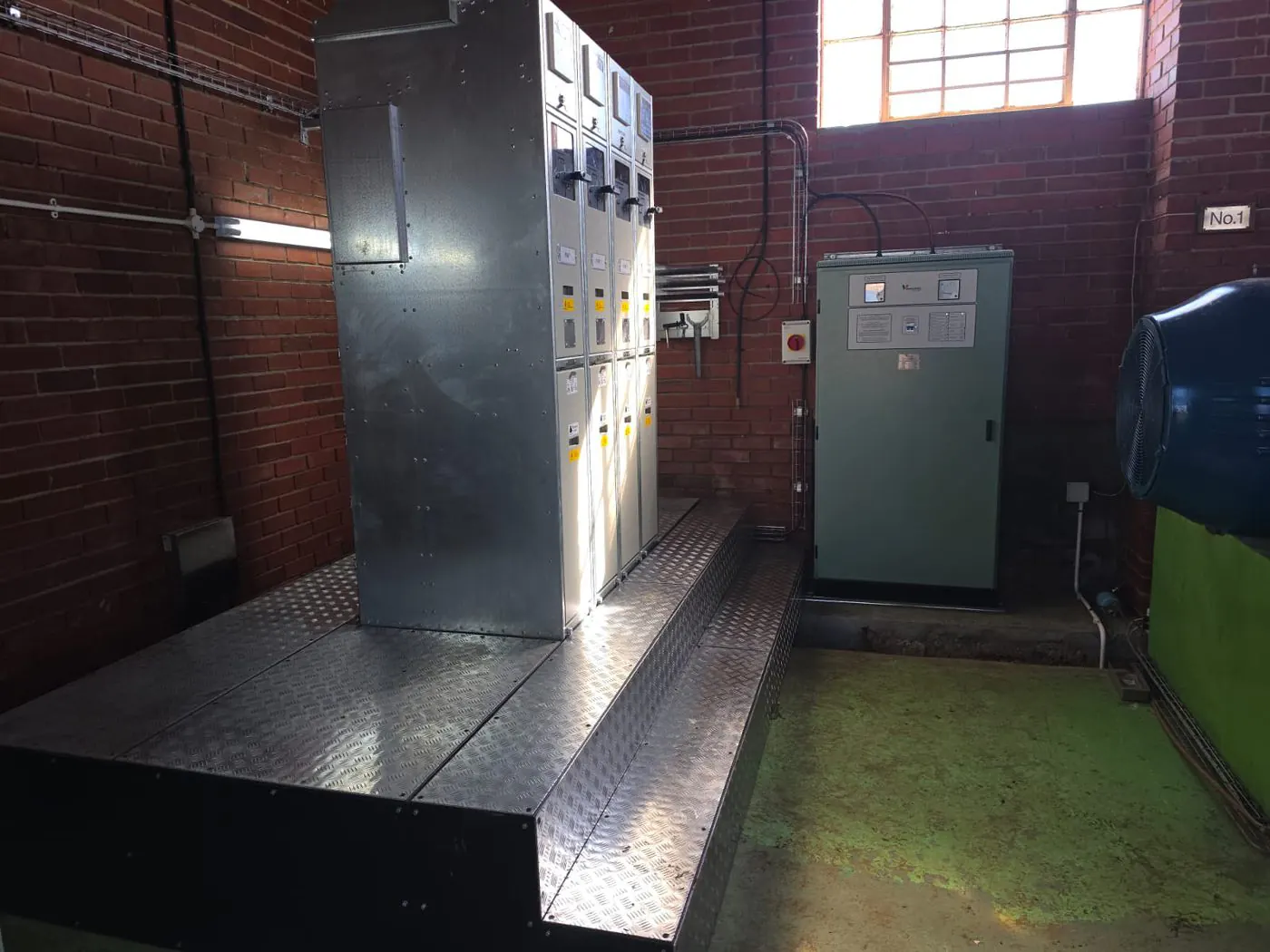 SGF/MVT switchgear and control panel installed on a raised platform in a client substation building